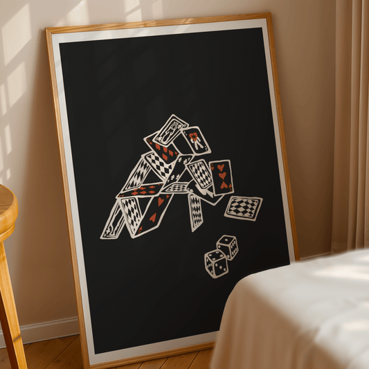  A modern wall print featuring a minimalist playing card design, displayed above a bed in a cozy bedroom. The artwork has a sleek, monochrome aesthetic with bold red and black card symbols, adding a stylish and contemporary touch to the room.